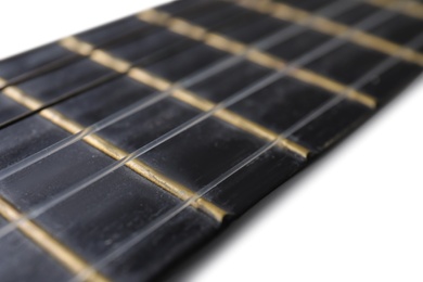 Closeup view of acoustic guitar, focus on neck with strings