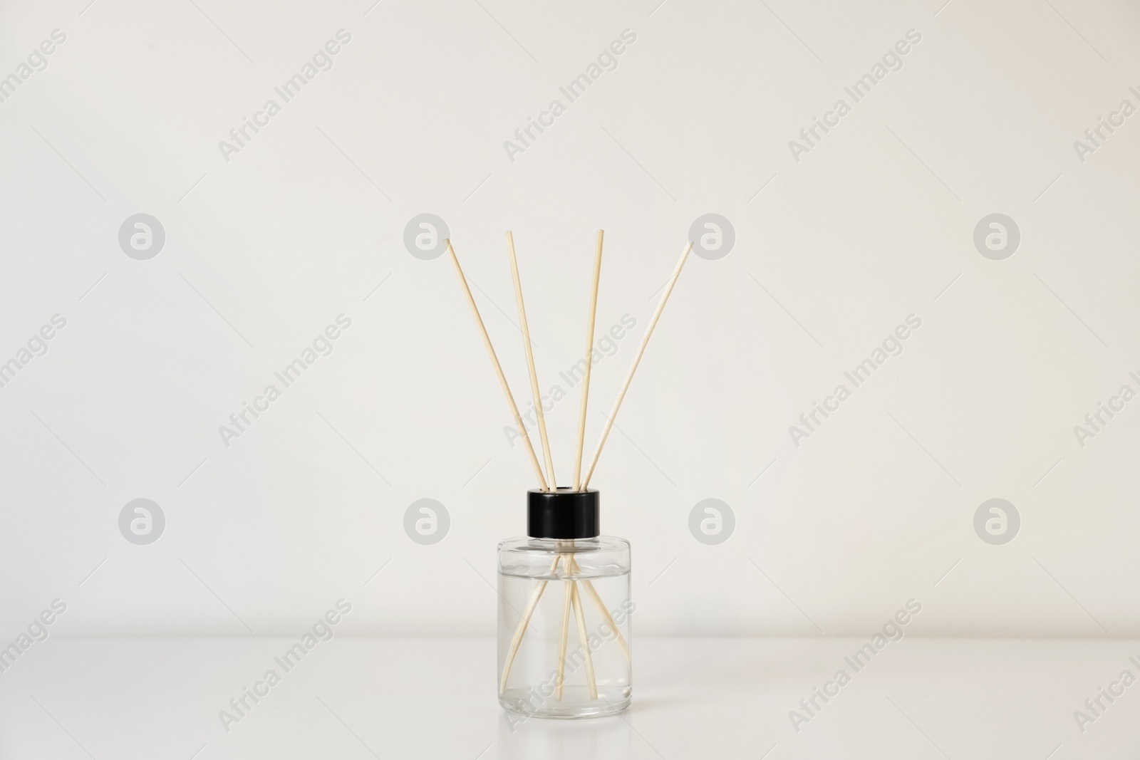 Photo of Aromatic reed air freshener on white table