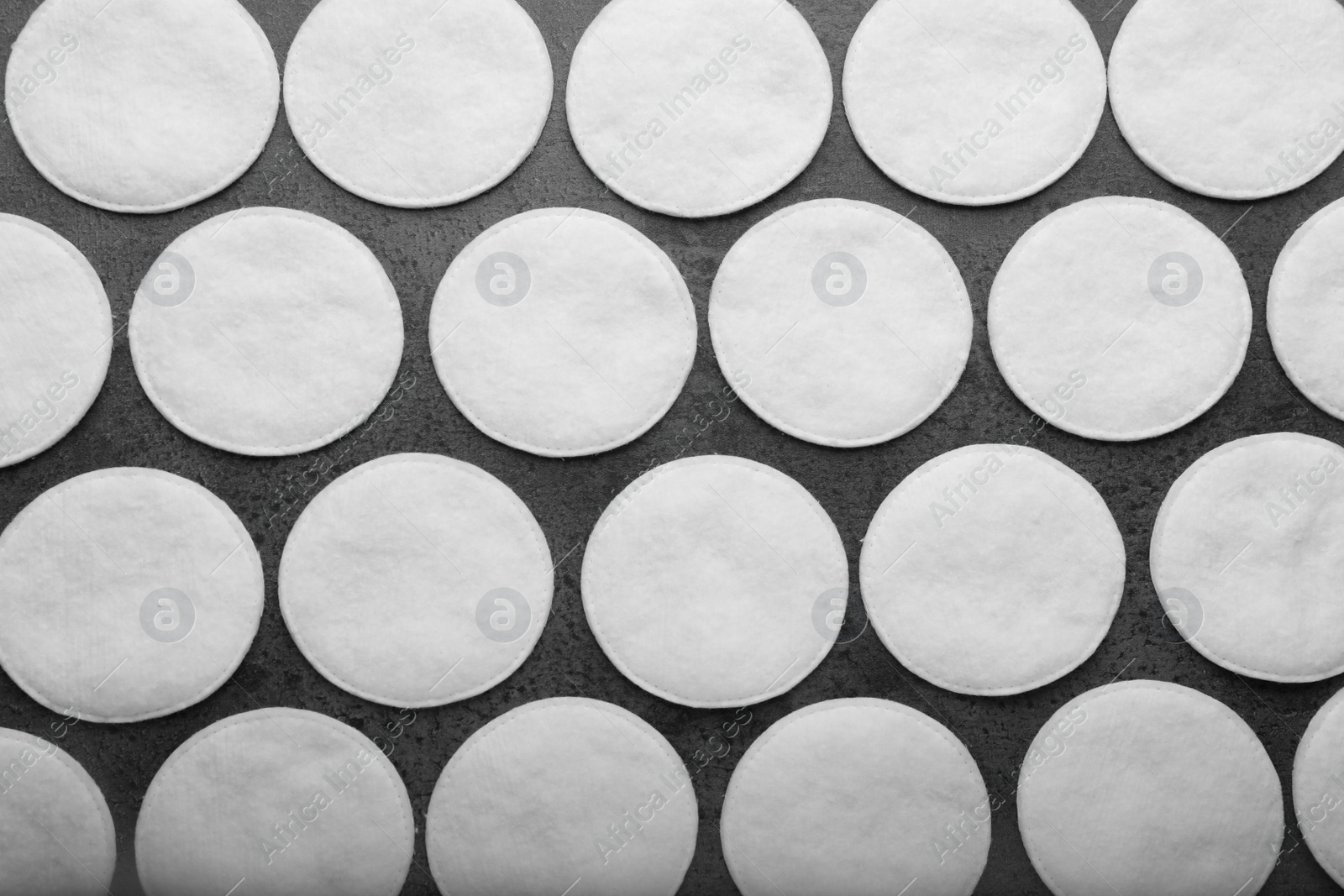 Photo of Many clean cotton pads on grey background, flat lay