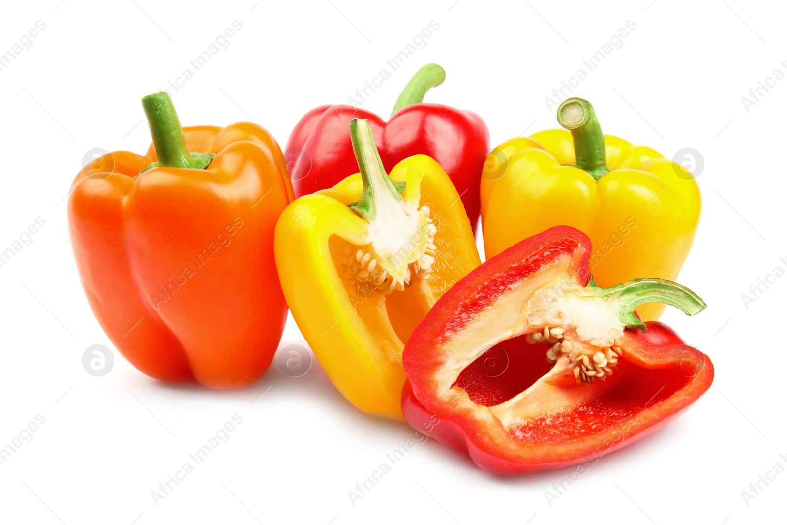 Photo of Whole and cut ripe bell peppers on white background