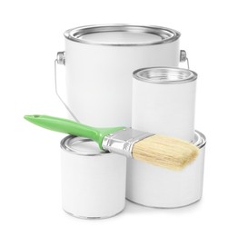 Photo of Closed blank cans of paint and brush on white background