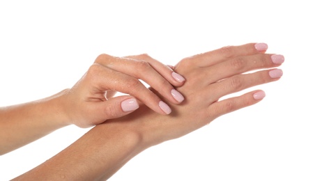 Photo of Woman with wet hands on white background, closeup. Spa treatment