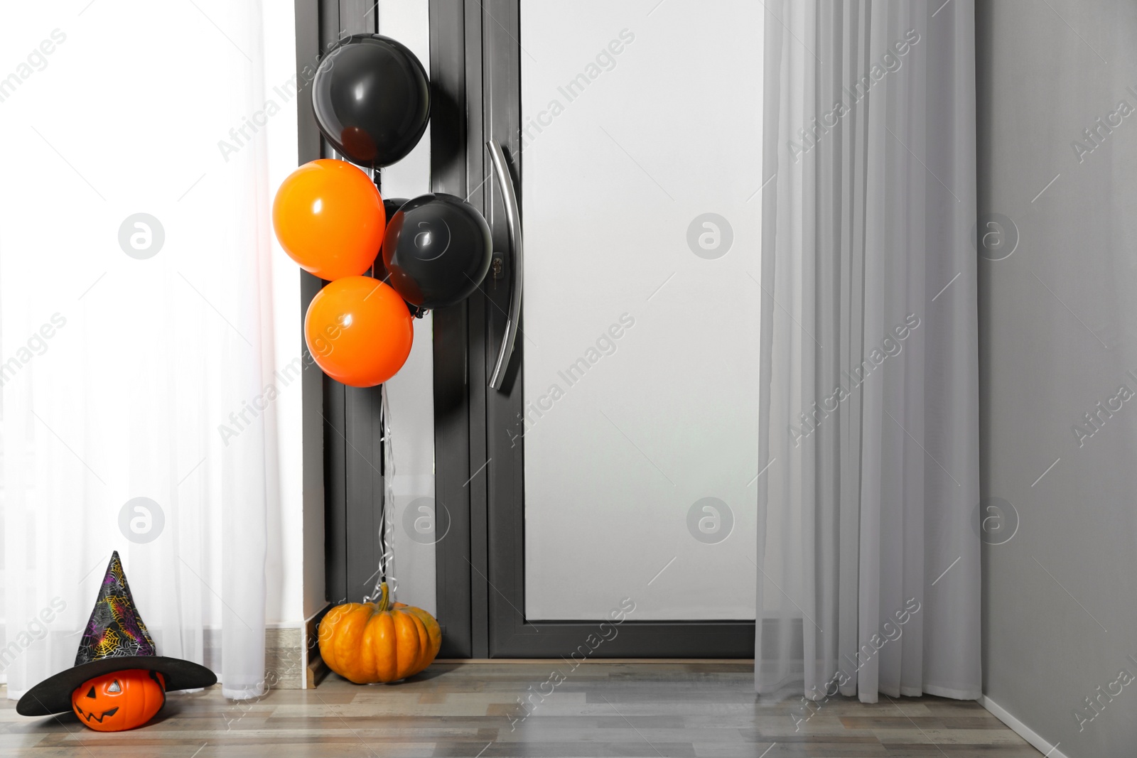Photo of Spacious hallway with balloons and pumpkins decorated for Halloween