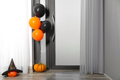 Spacious hallway with balloons and pumpkins decorated for Halloween