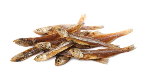 Photo of Delicious dried salted anchovies on white background