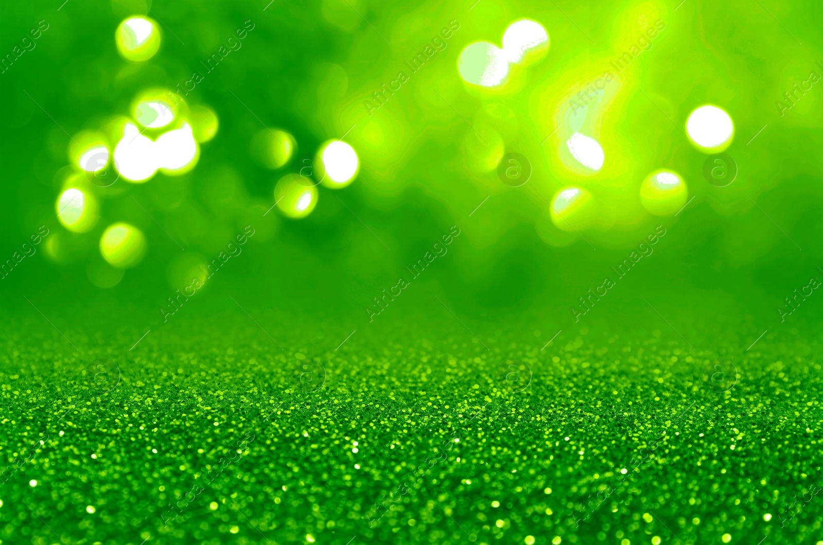 Image of St. Patrick day. Shiny green glitter, closeup. Bokeh effect