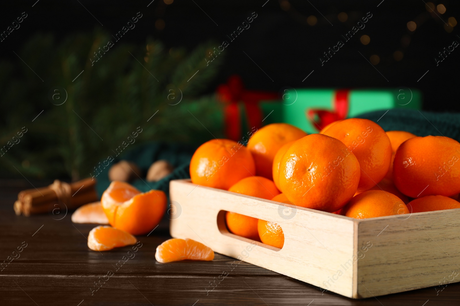 Photo of Tasty fresh tangerines on wooden table. Christmas celebration