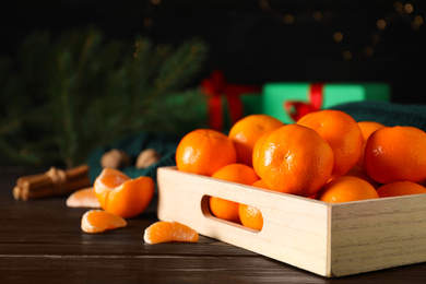 Tasty fresh tangerines on wooden table. Christmas celebration