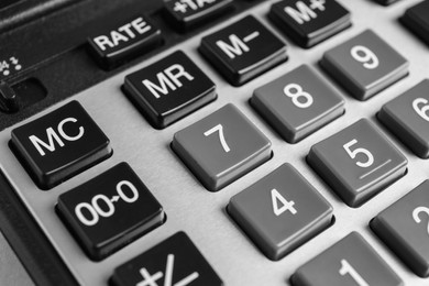 Closeup view of modern calculator as background