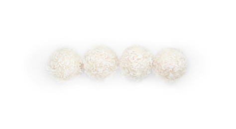 Photo of Tasty coconut balls isolated on white, top view