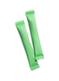 Green sticks of sugar on white background, top view