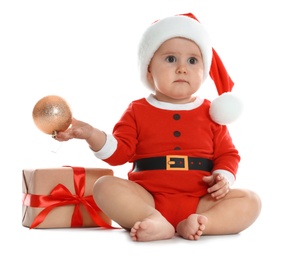 Photo of Festively dressed little baby with Christmas gift on white background