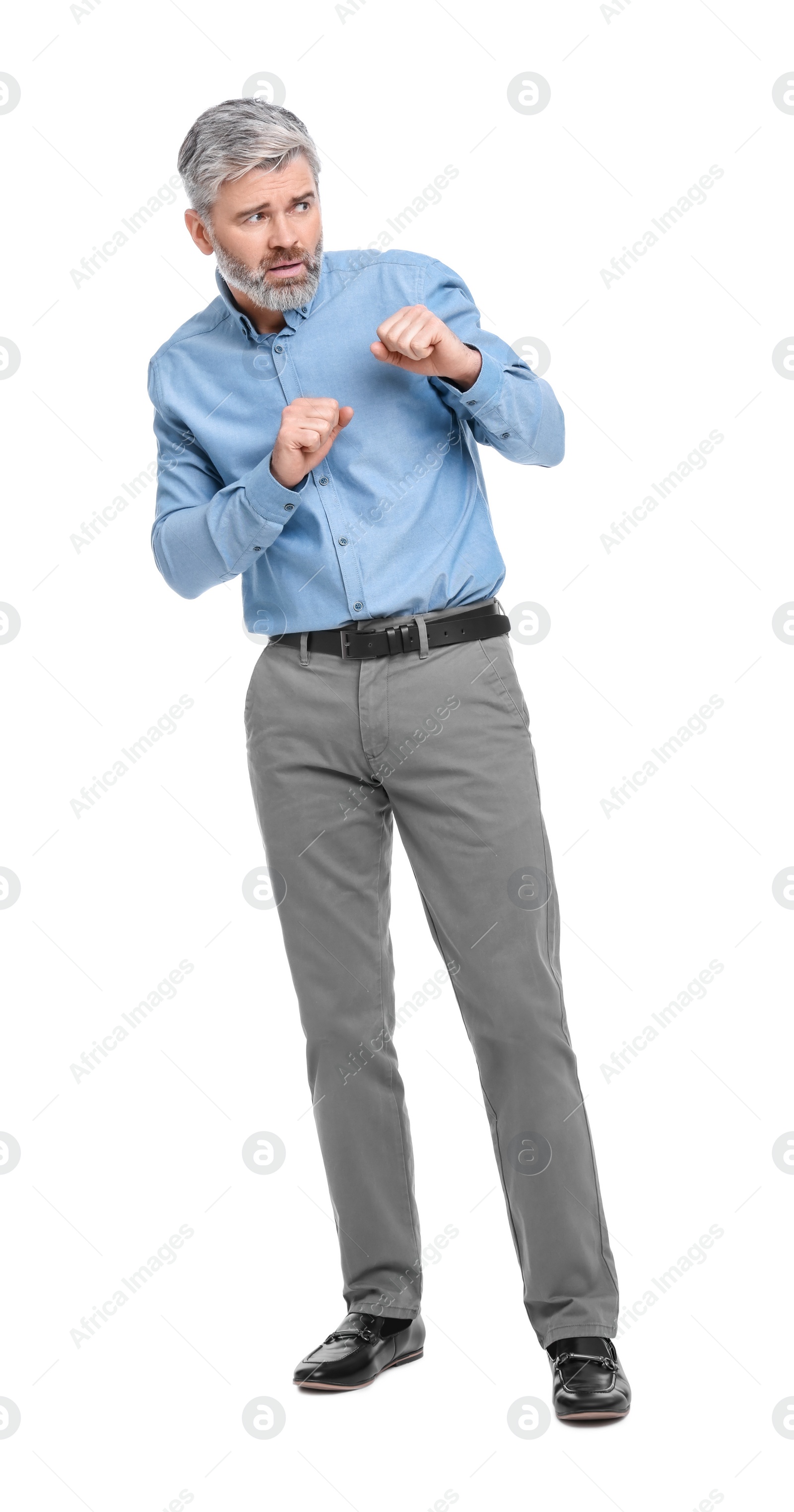 Photo of Mature businessman in stylish clothes posing on white background