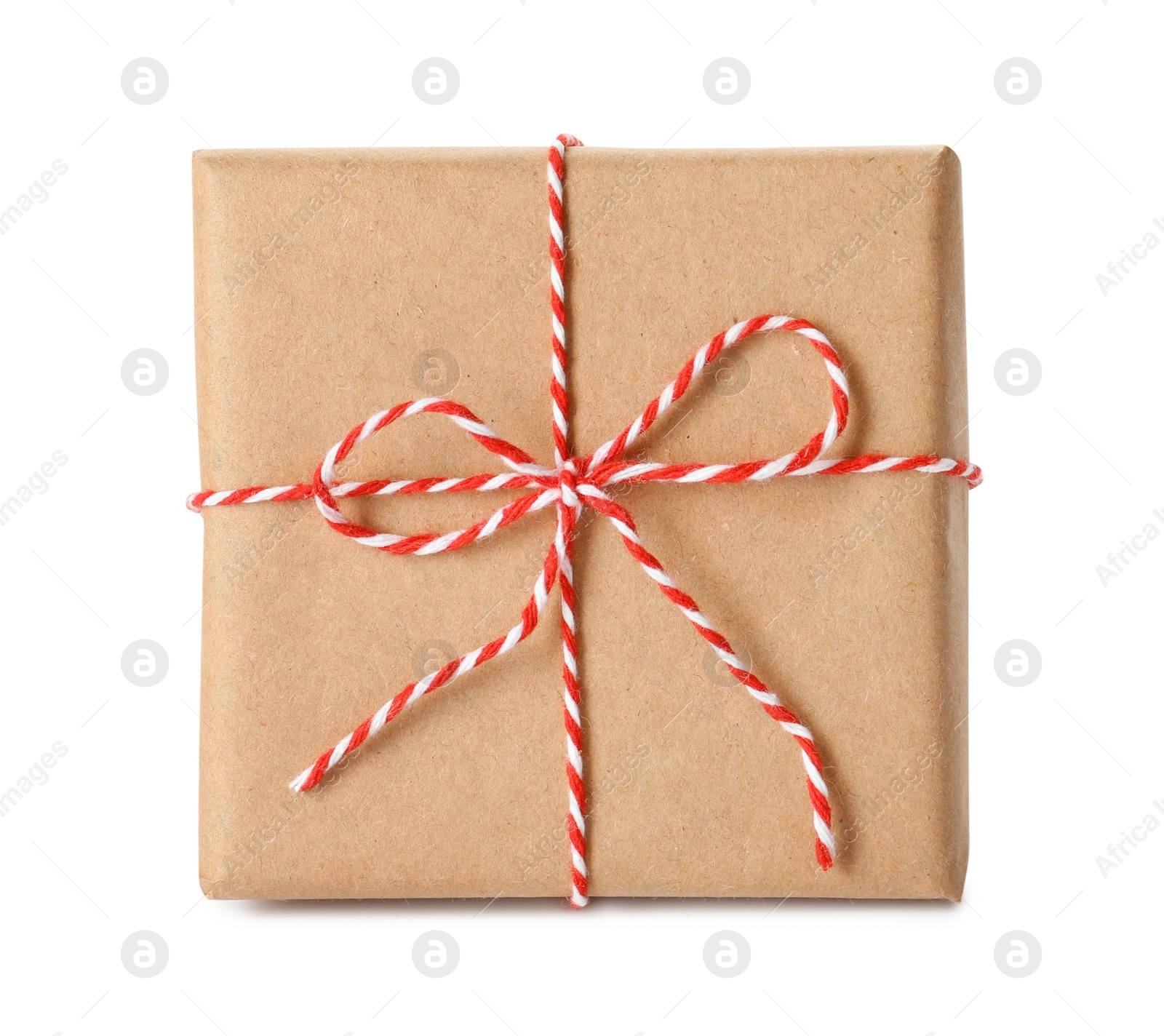 Photo of Gift box wrapped in kraft paper with bow isolated on white