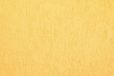 Texture of yellow plaster wall as background