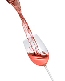 Image of Pouring delicious rose wine into glass on white background