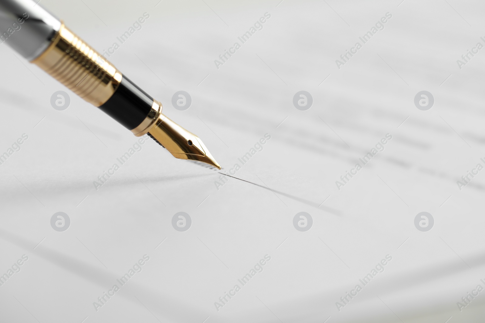 Photo of Signing document with fountain pen, closeup. Notary services