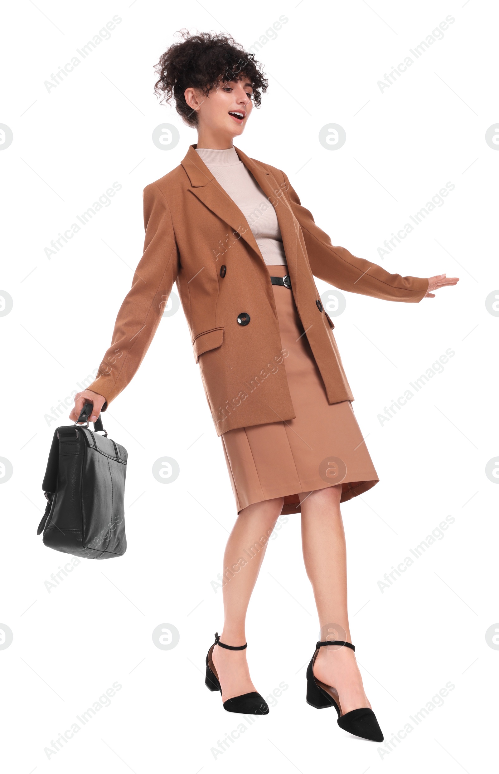 Photo of Beautiful businesswoman in suit with briefcase walking on white background