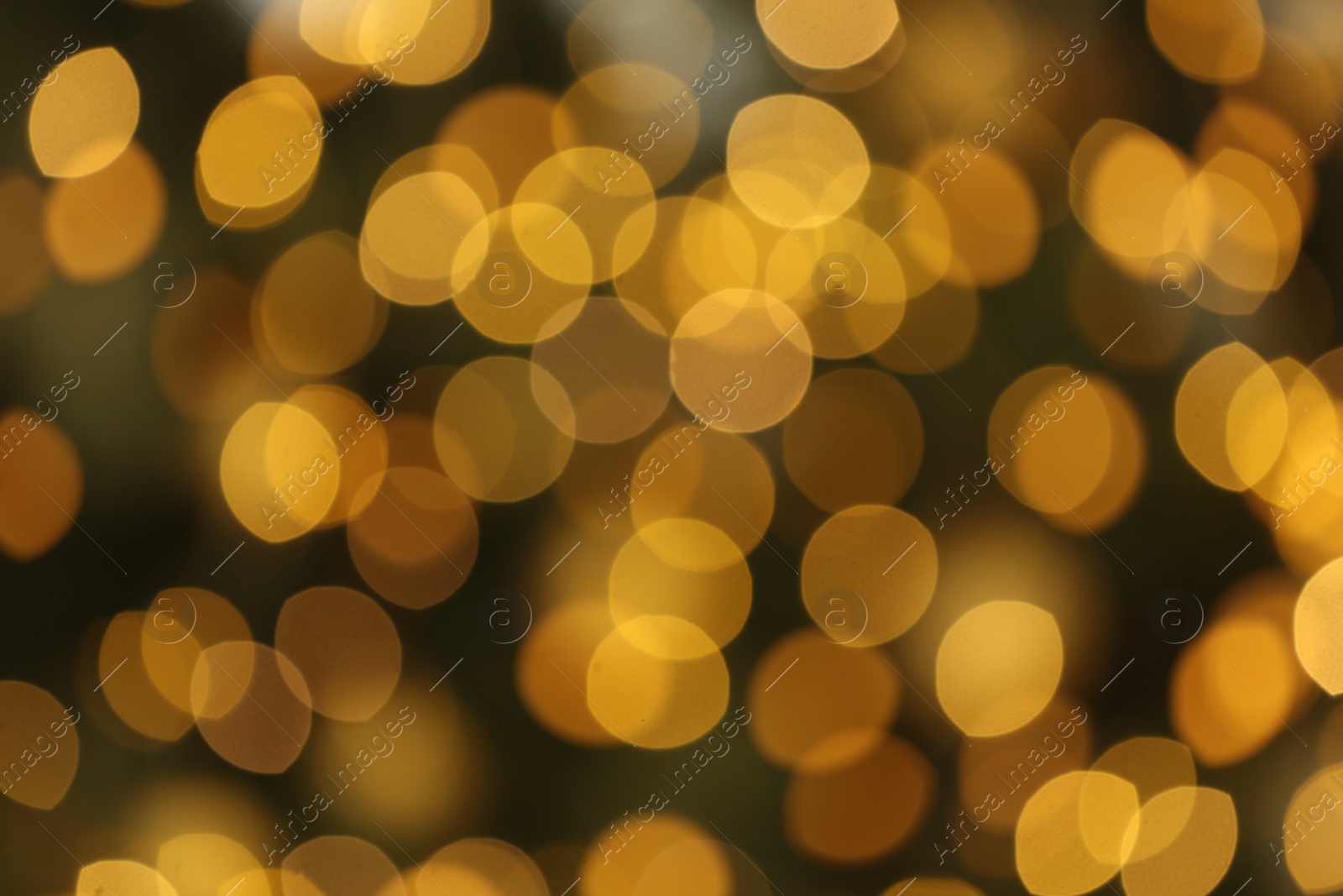 Photo of Blurred view of glowing Christmas lights as background. Festive mood