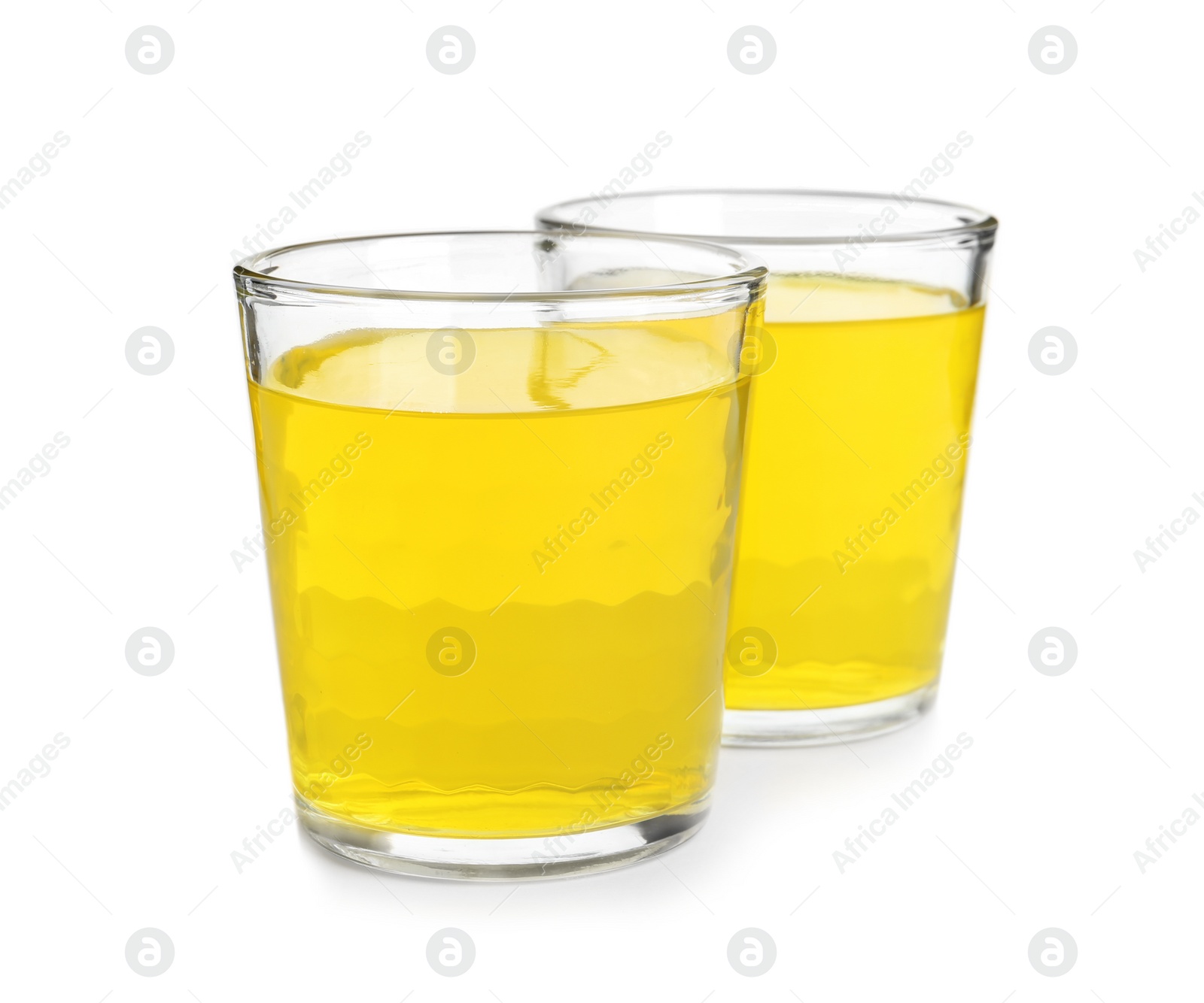 Photo of Tasty jelly desserts in glasses on white background