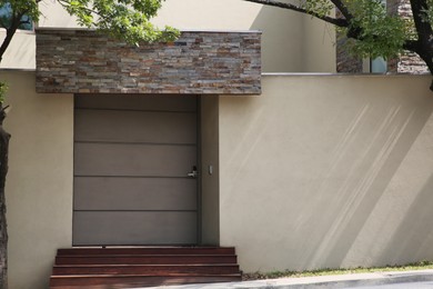 Photo of Entrance of house with stylish door outdoors