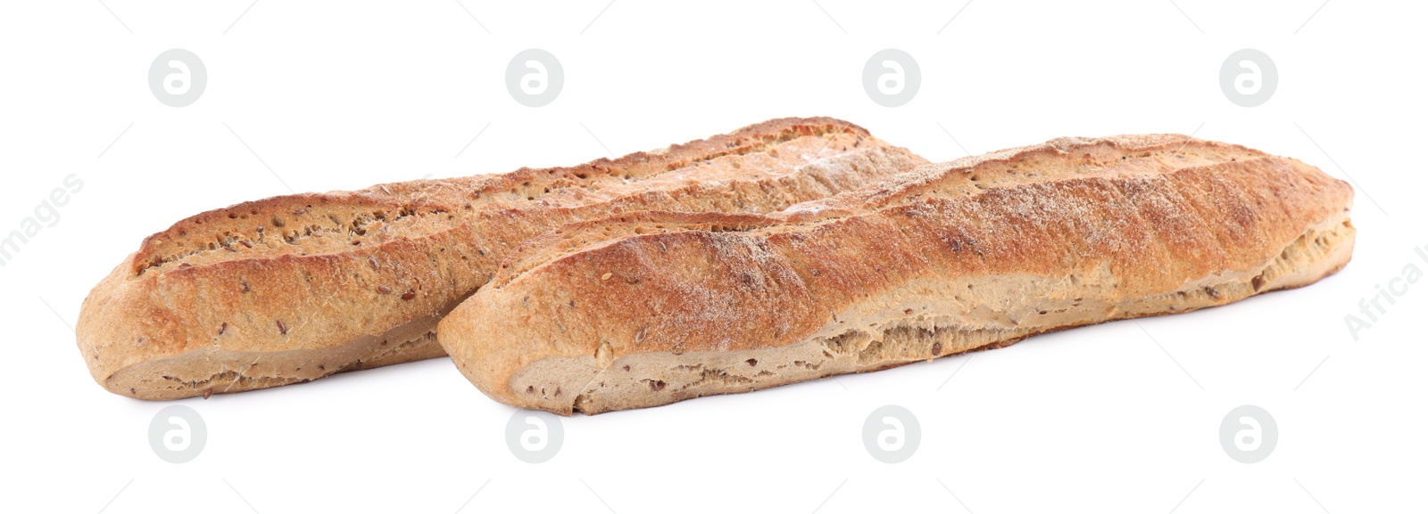 Photo of Tasty buckwheat baguettes on white background. Fresh bread