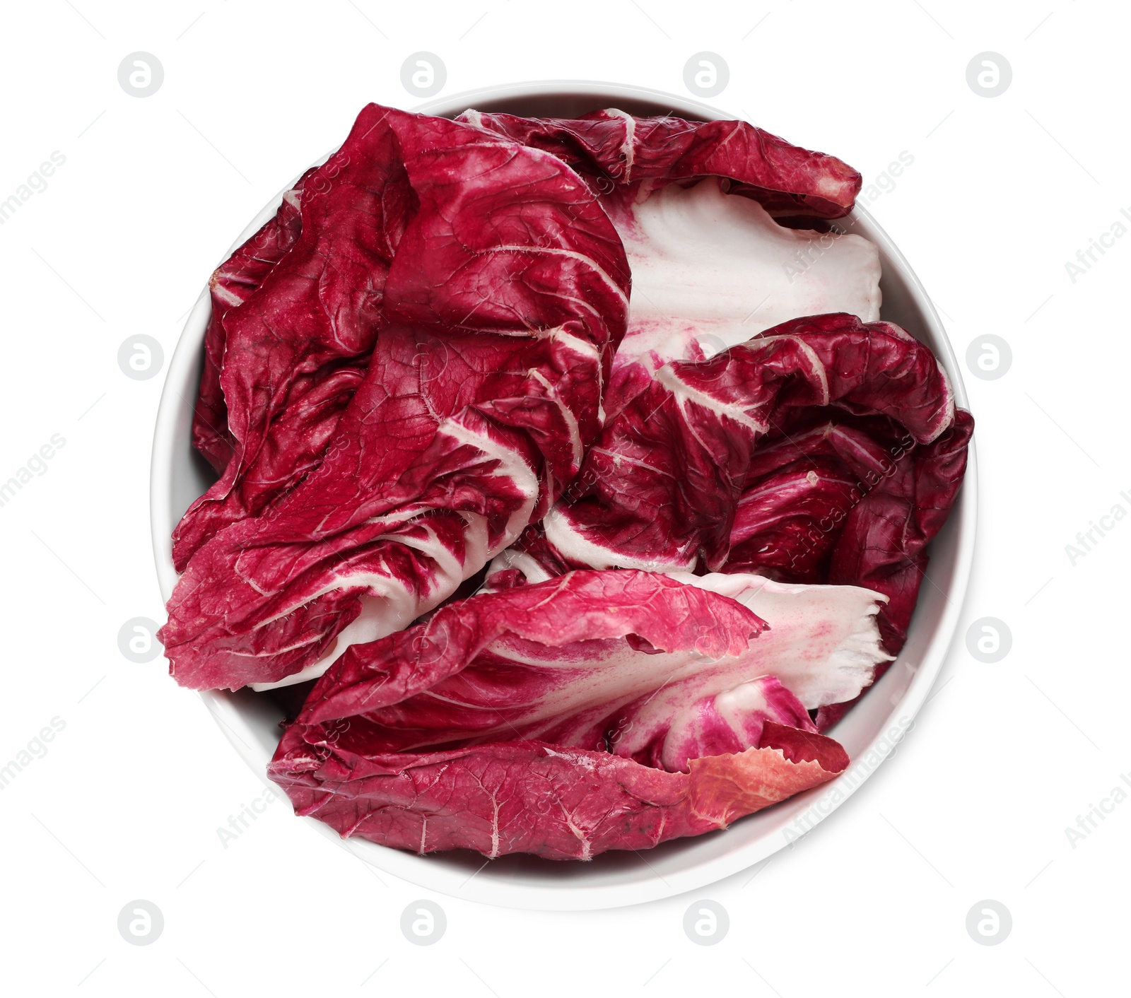 Photo of Leaves of ripe radicchio in bowl on white background, top view