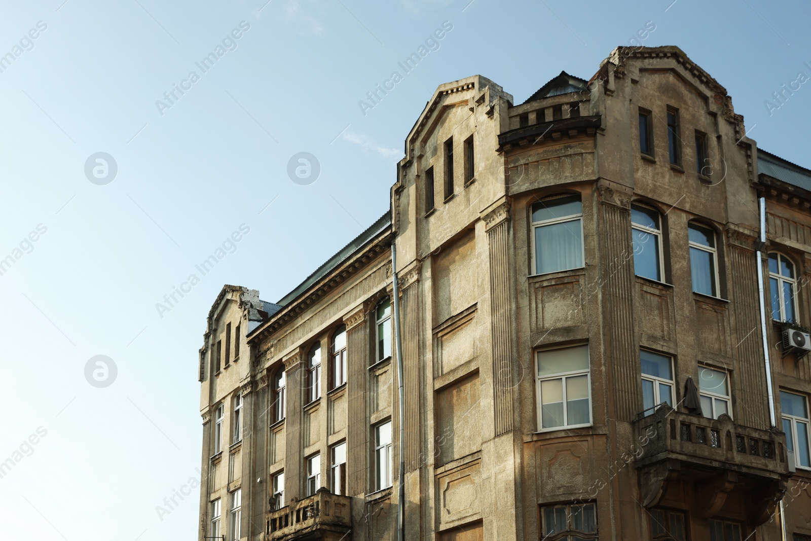 Photo of Beautiful old residential building against blue sky