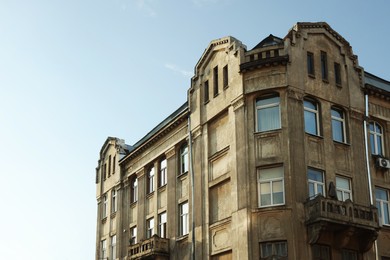 Beautiful old residential building against blue sky