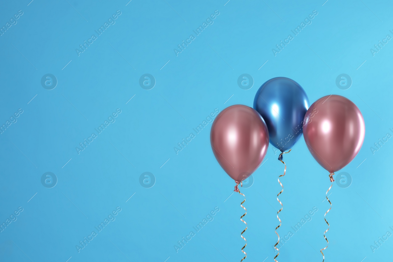 Photo of Bright balloons on color background. Space for text