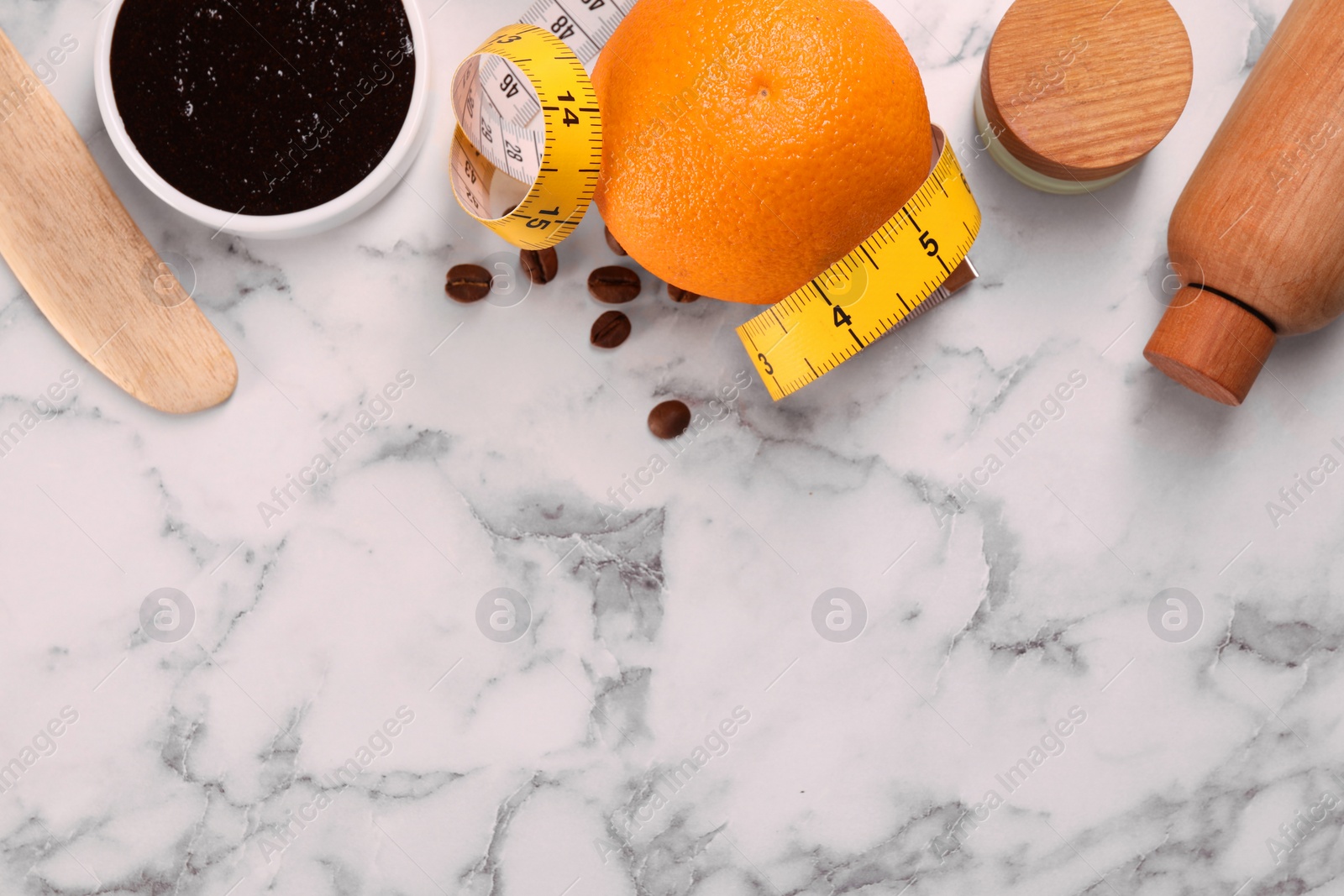 Photo of Flat lay composition with natural body scrub and fresh ingredients on white marble table, space for text. Anti cellulite treatment