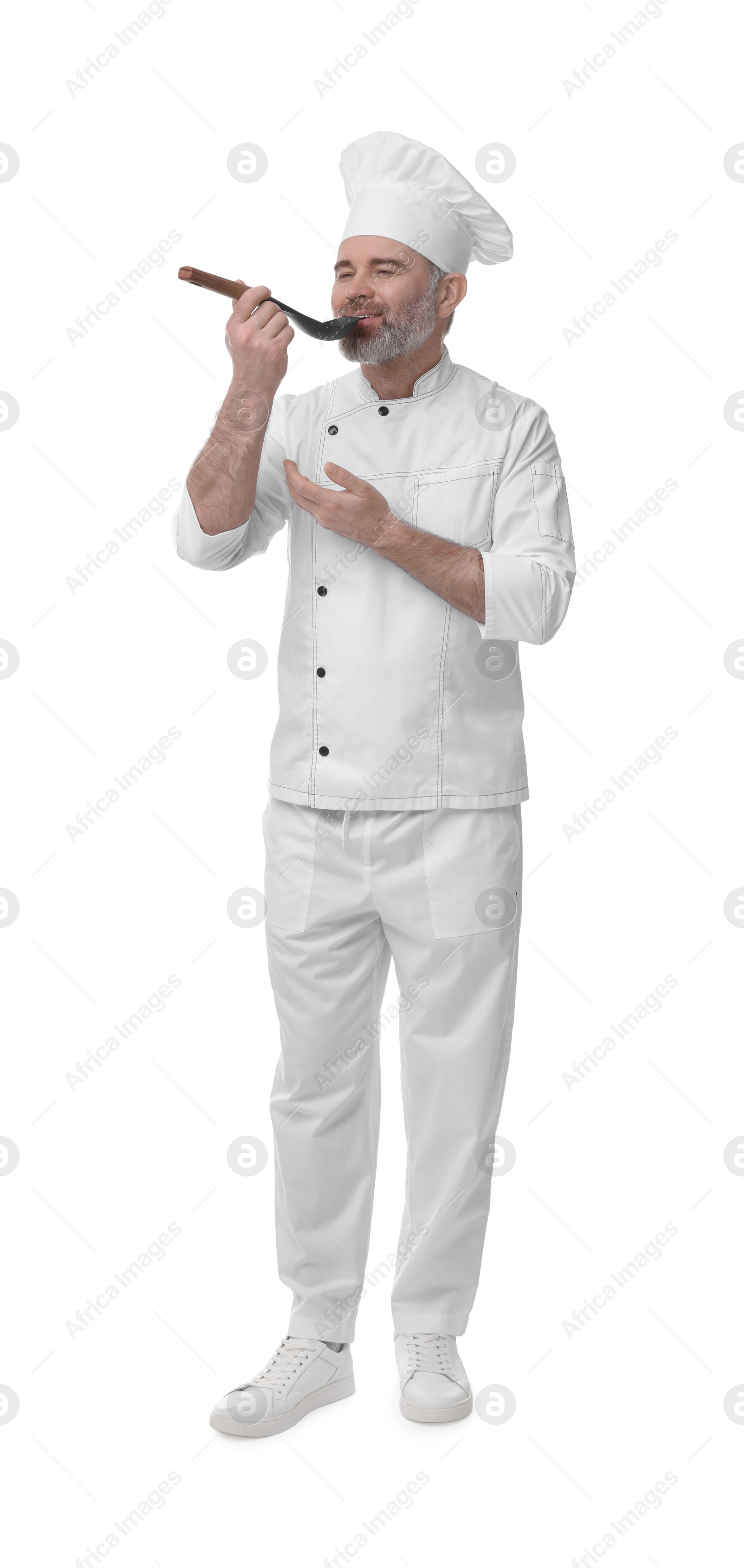 Photo of Chef in uniform tasting something on white background
