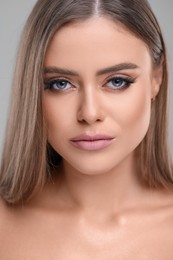 Photo of Portrait of beautiful young woman with makeup