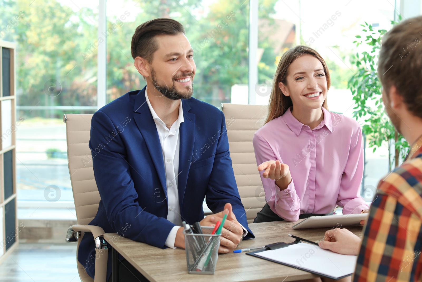 Photo of Human resources commission conducting job interview with applicant in office