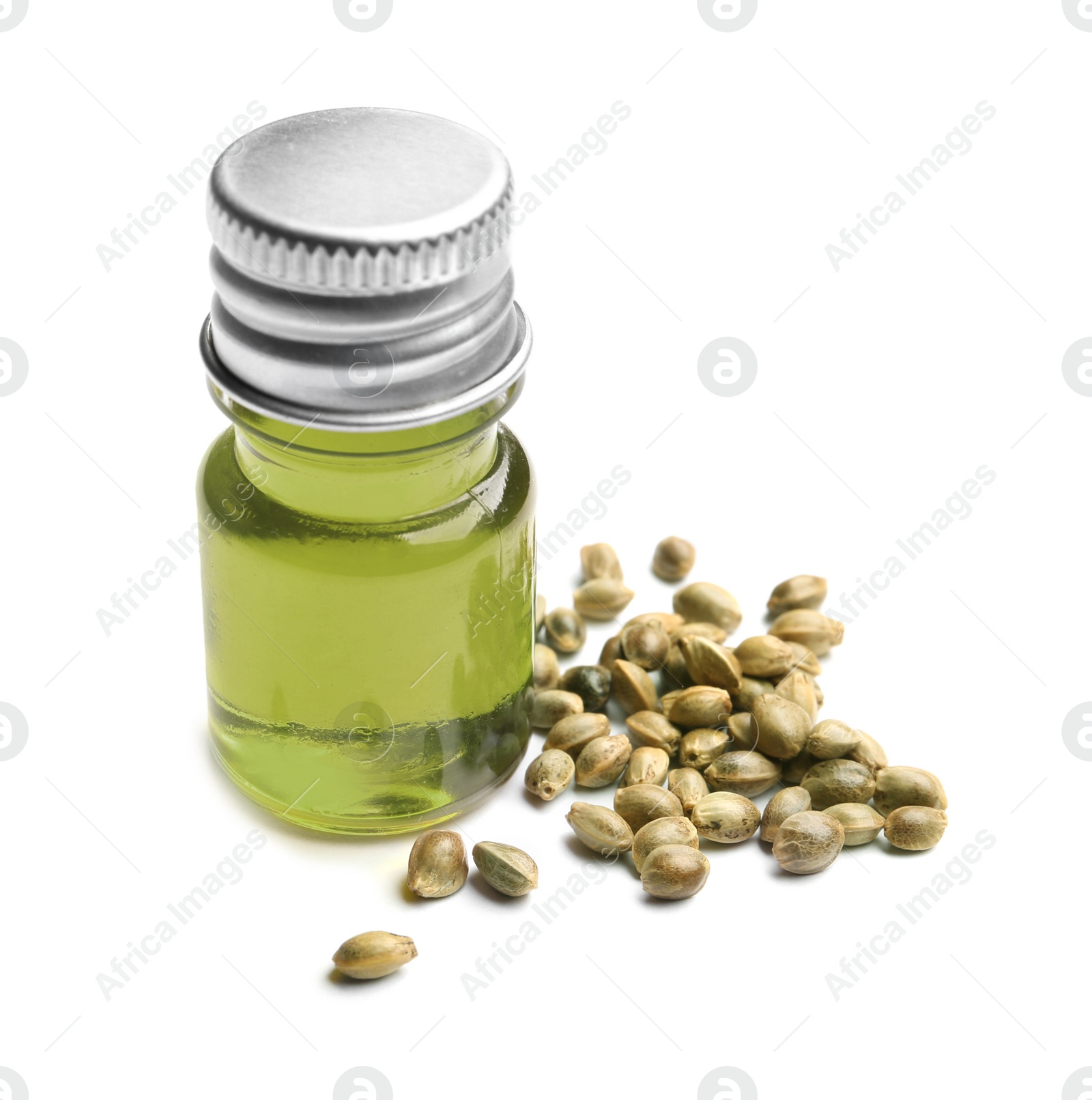 Photo of Bottle with hemp oil and seeds on white background