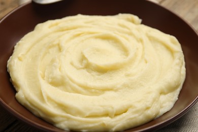 Photo of Freshly cooked homemade mashed potatoes in plate, closeup