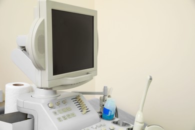 Photo of Ultrasound machine near white wall in hospital