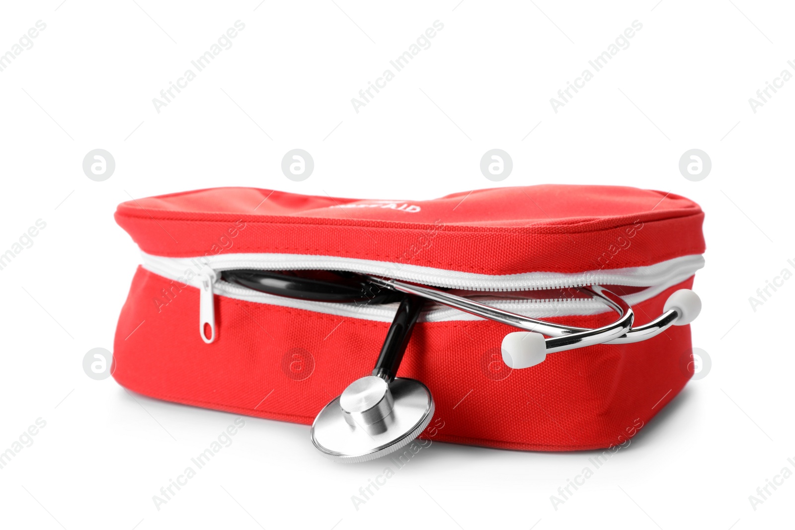 Photo of First aid kit with stethoscope on white background