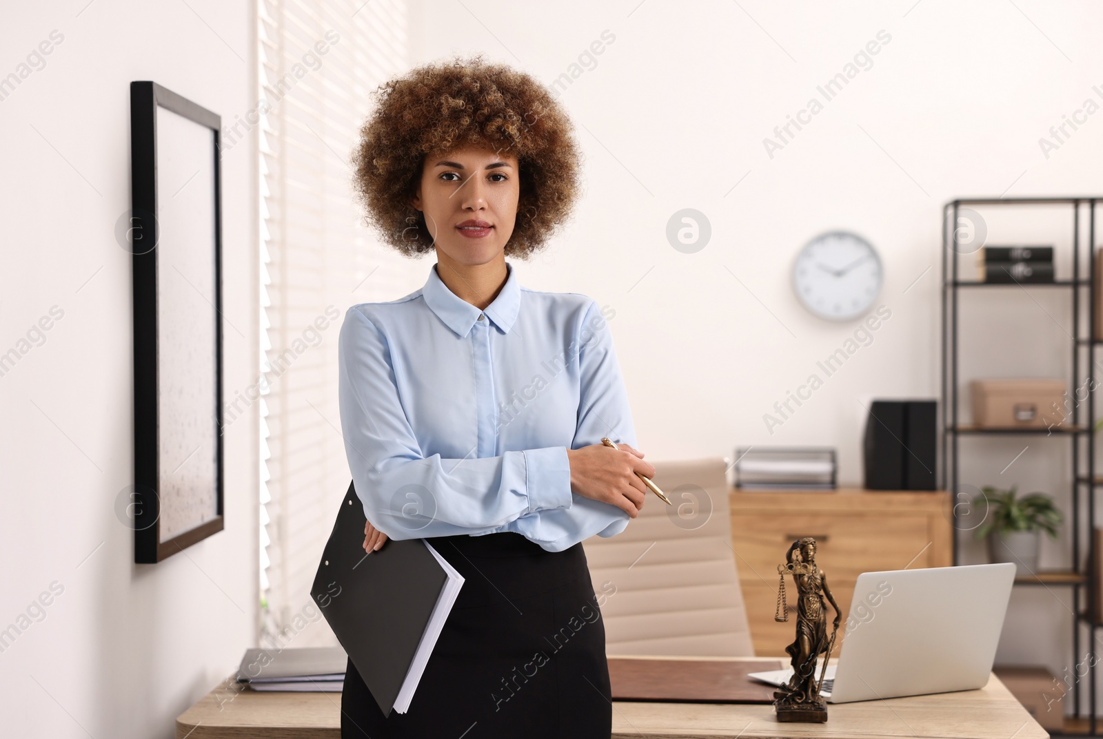 Photo of Notary with clipboard and pen in office