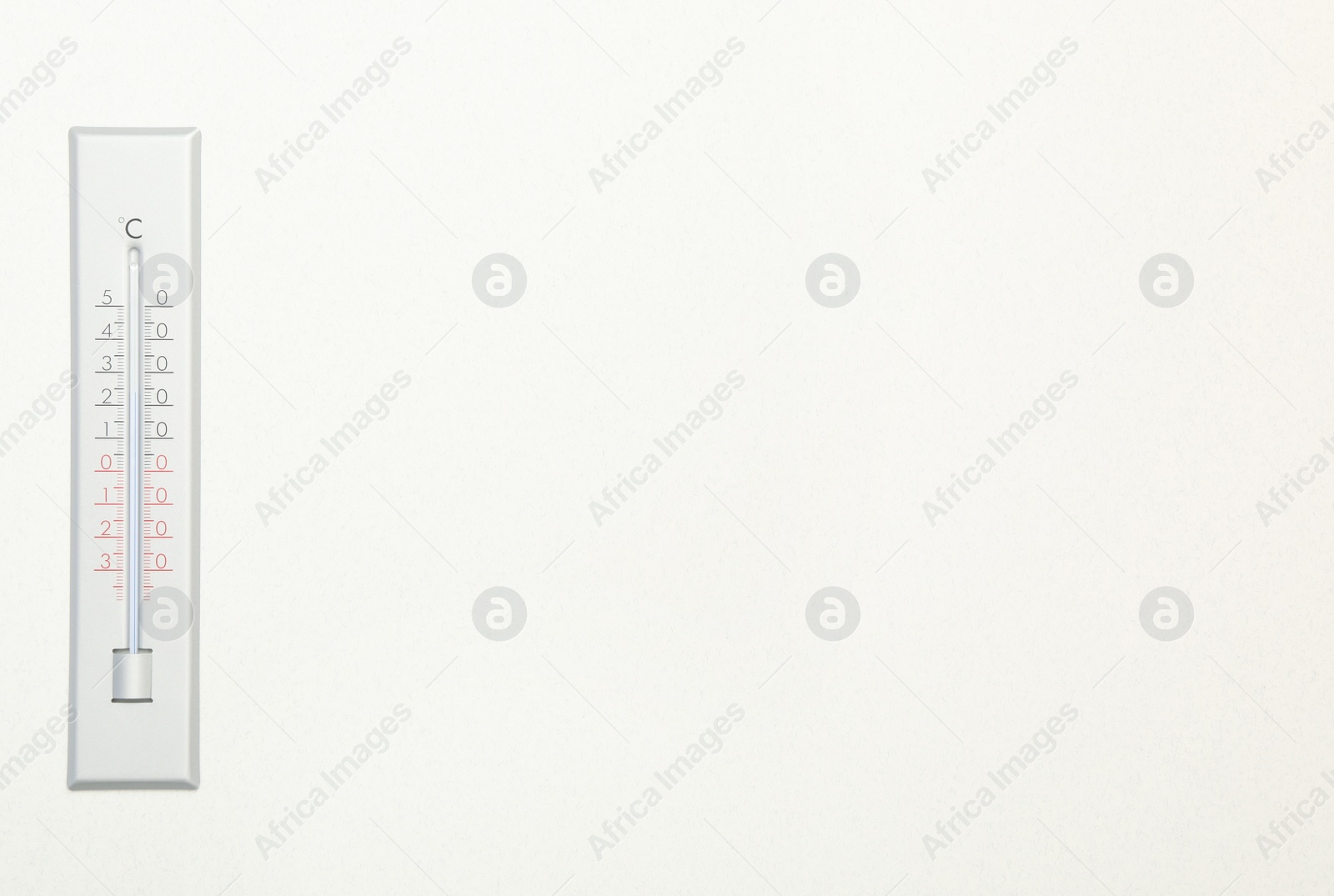 Photo of Weather thermometer on white background, top view. Space for text