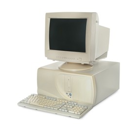 Old computer monitor, keyboard and system unit on white background