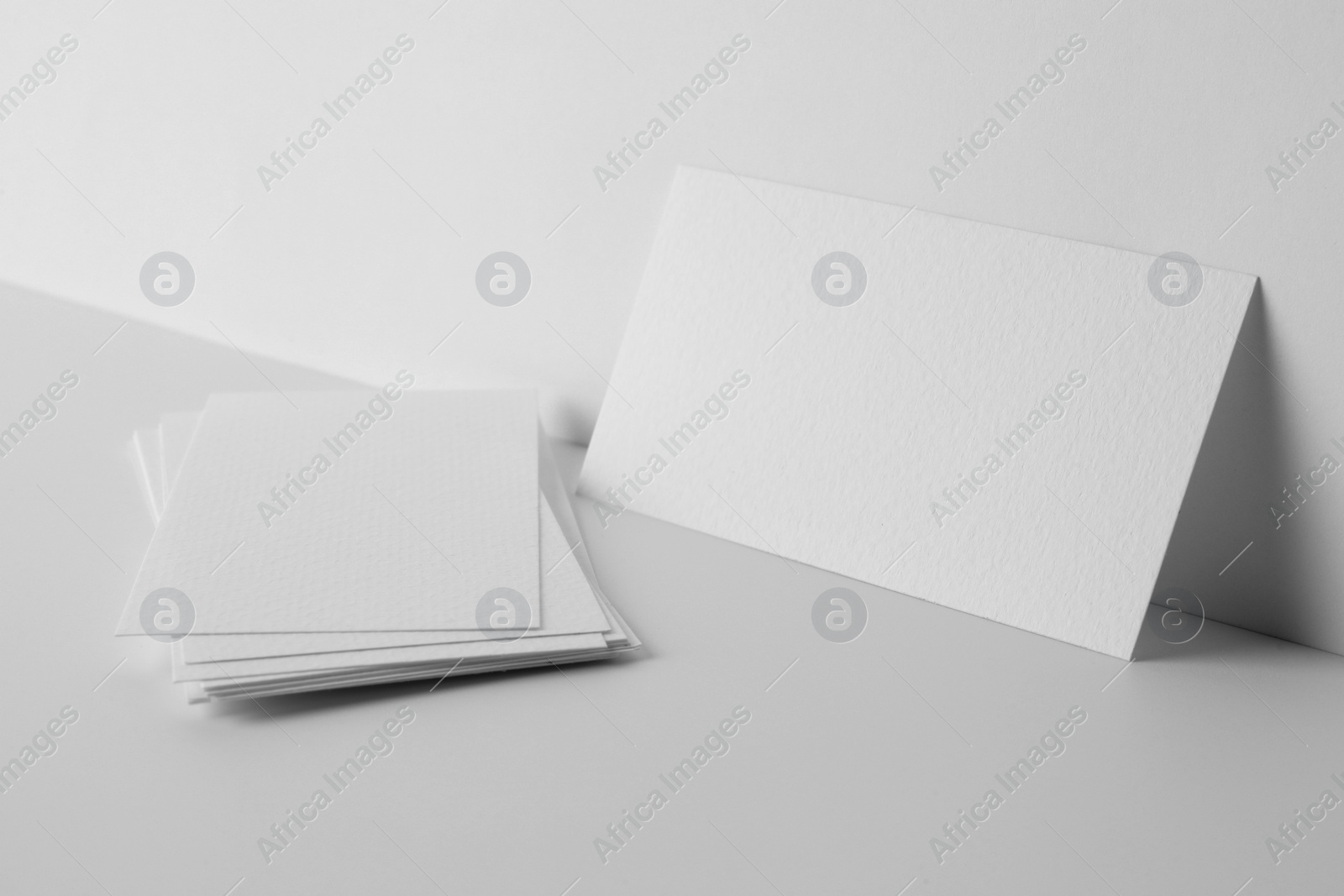 Photo of Blank business cards on white background. Mockup for design