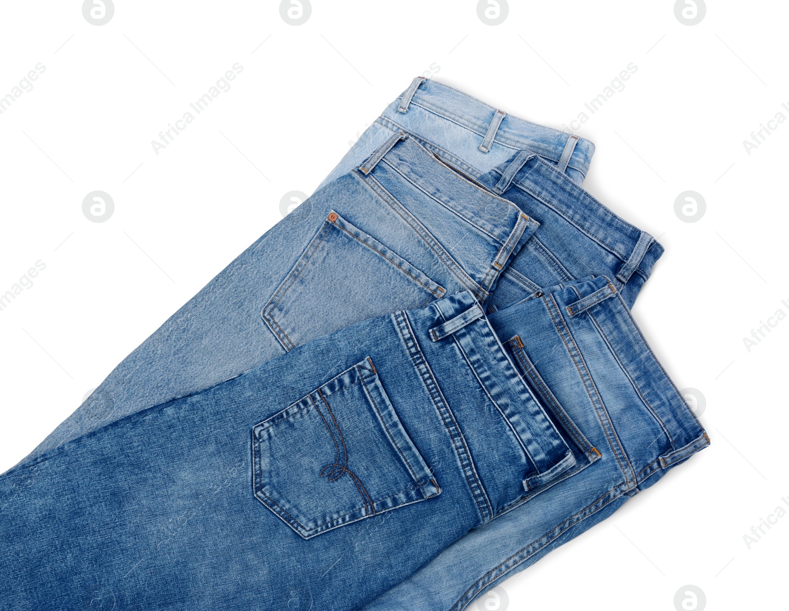 Photo of Different stylish jeans isolated on white, top view