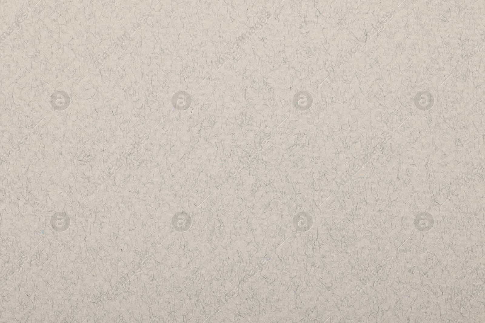 Photo of Texture of light grey paper sheet as background, top view