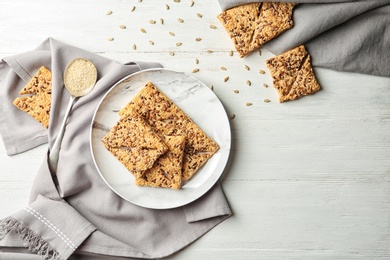 Photo of Plate with grain cereal cookies on table, top view. Healthy snack