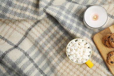 Photo of Flat lay composition with cup of hot cocoa on blanket. Winter drink