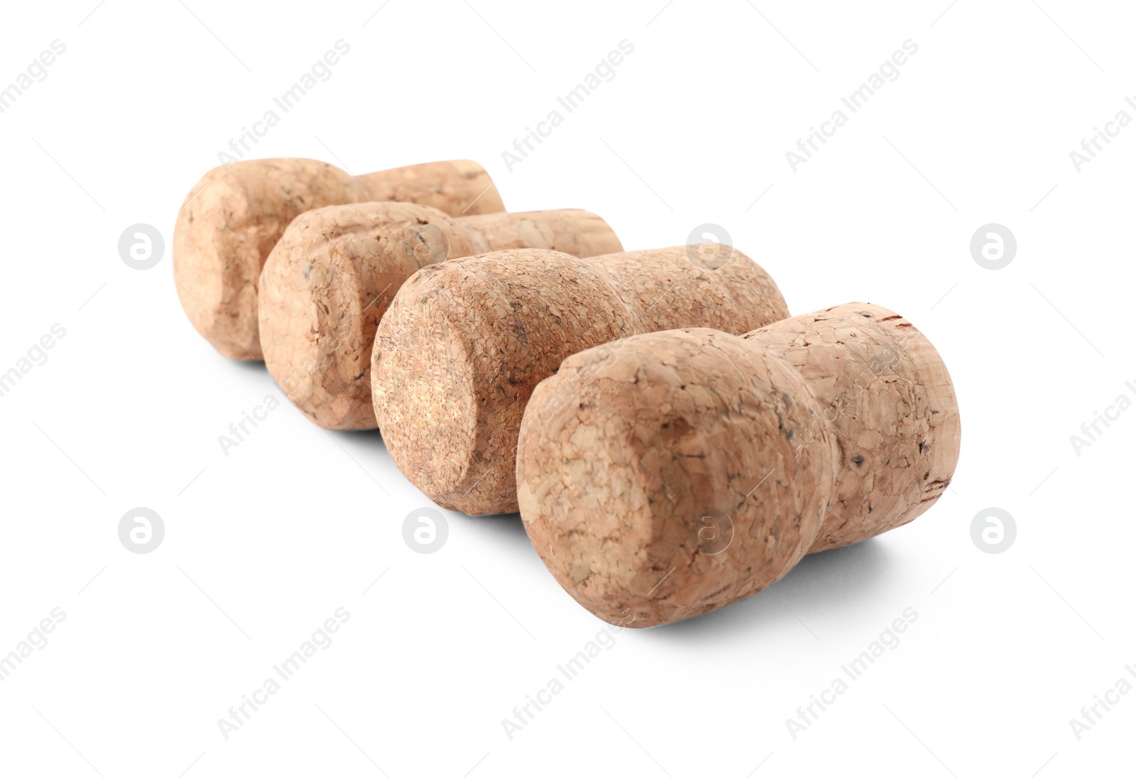 Photo of Many sparkling wine corks on white background