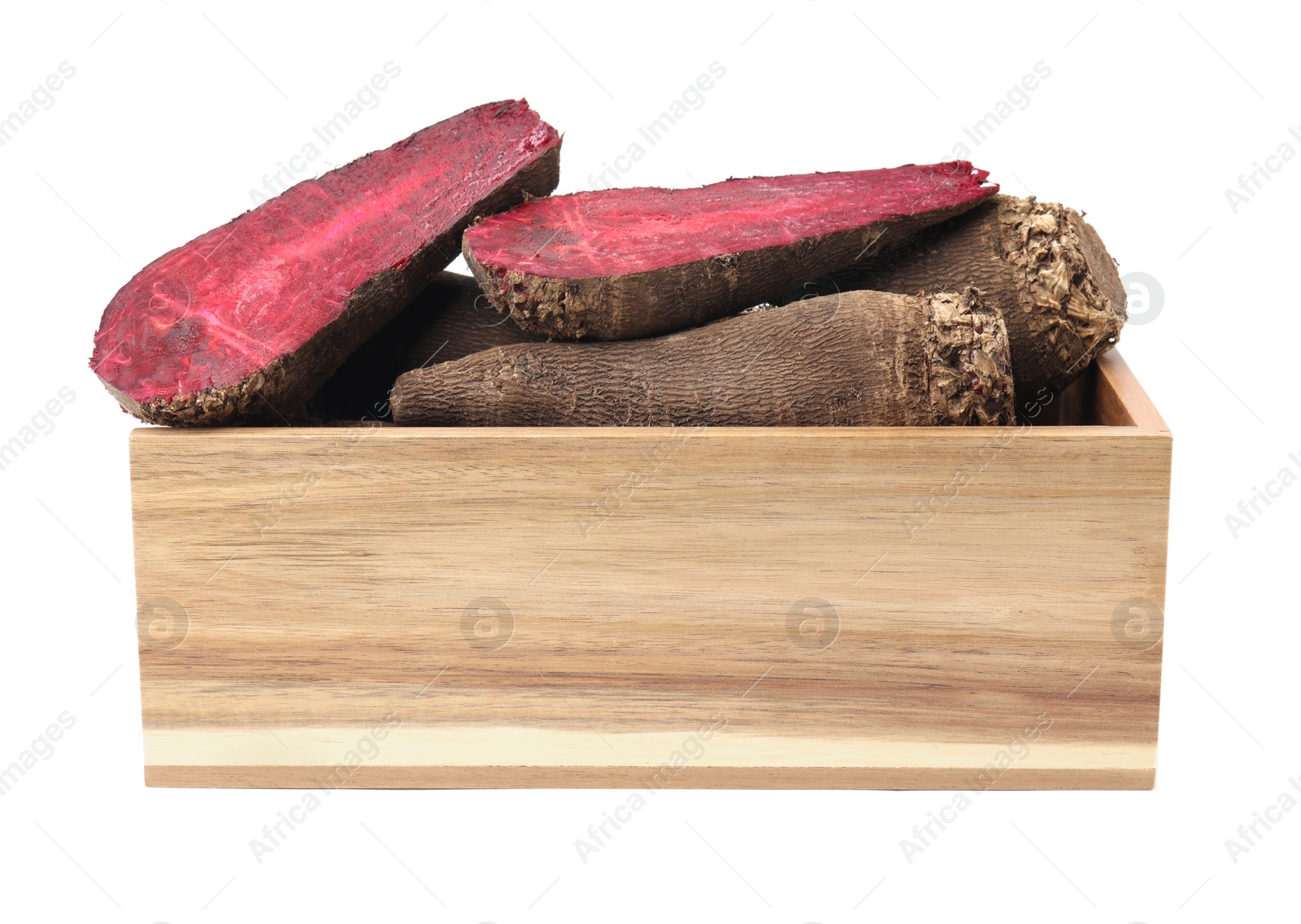 Photo of Whole and cut red beets in wooden crate isolated on white