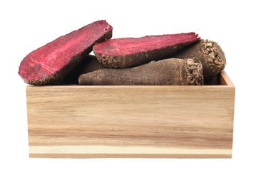 Whole and cut red beets in wooden crate isolated on white