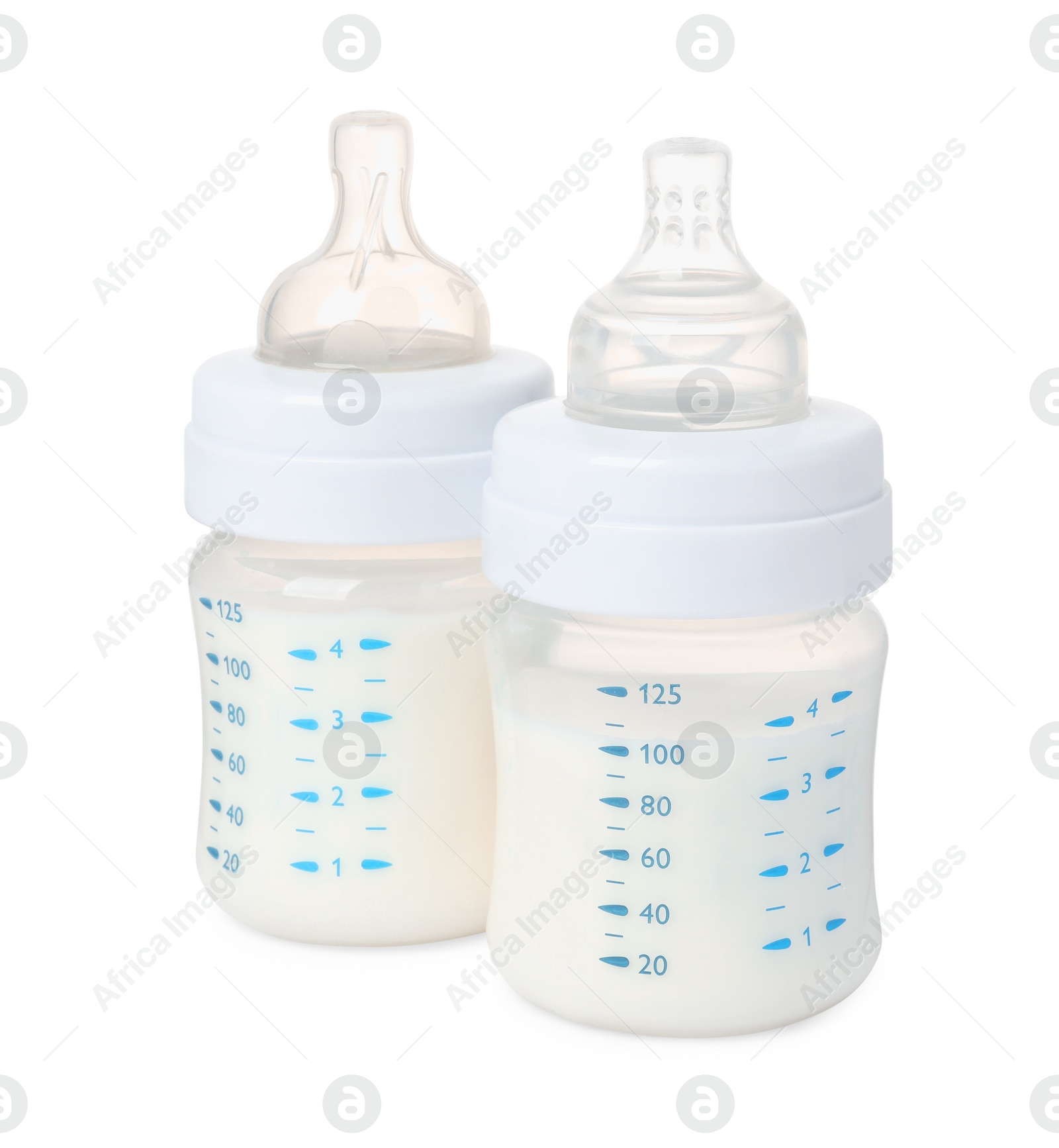 Photo of Two feeding bottles with infant formula on white background